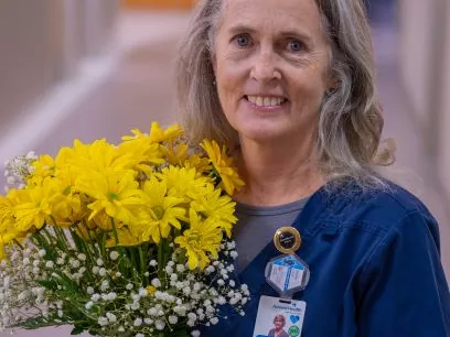 AdventHealth Hendersonville DAISY Award winner offers compassionate  care to a patient in pain.