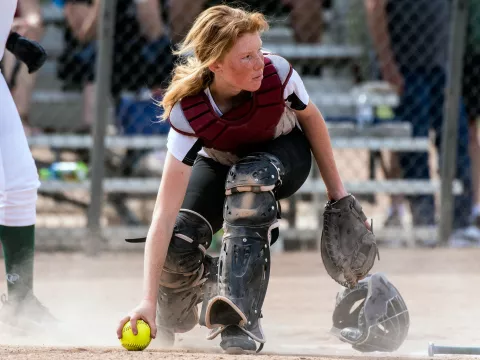 High school girl playing softball