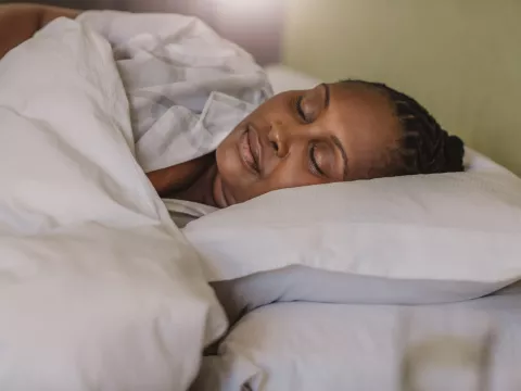 A Woman Sleeps Soundly in Her Bed