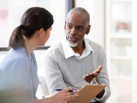 A Patient Speaks with a Provider in an Exam Room of a Medical Practice. 