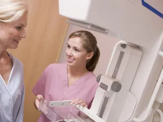 Mammogram technician with patient.