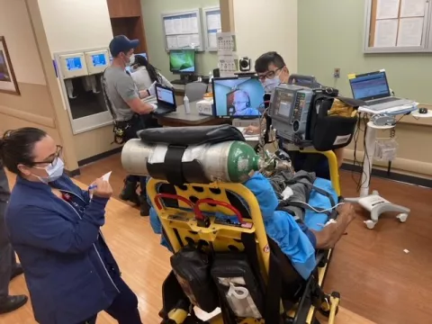 Members of the AH Orlando stroke team in action. A neurologist provides telemedicine via video screen for this patient similar to what was done for Holly Mahedeo.
