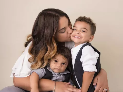 mother embracing her children