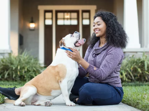 Woman playing with her dog.