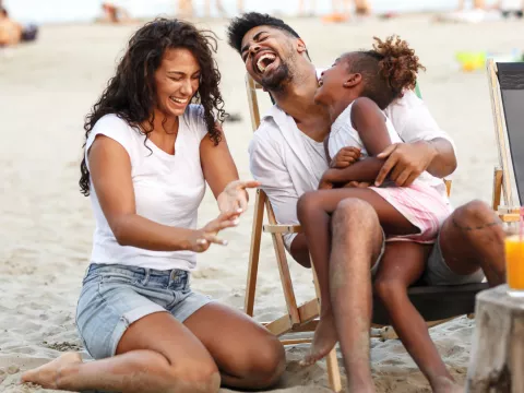 Family enjoying the beach in summertime.