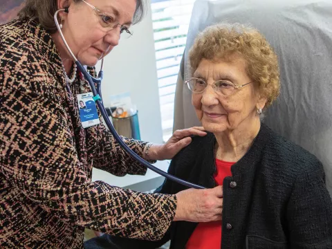 Sharon Kast, FNP, with a patient