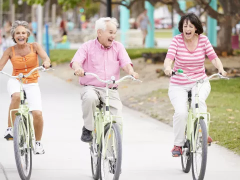 Three People Riding a Bike