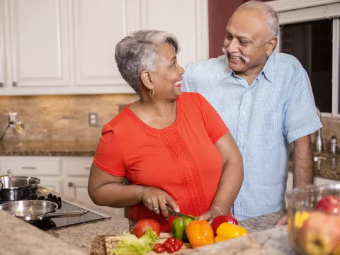 A couple cooks a heart-healthy meal together