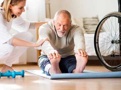 Man doing physical therapy at home