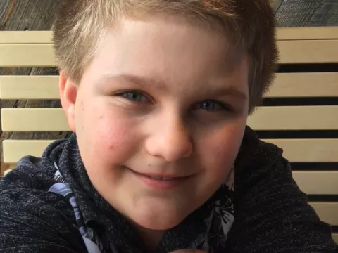 A picture of a boy smiling.