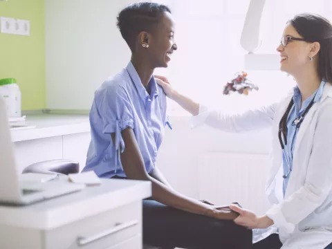 A woman at her annual check up with her trusted doctor