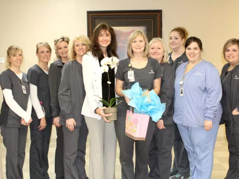  A group of women standing next to each other