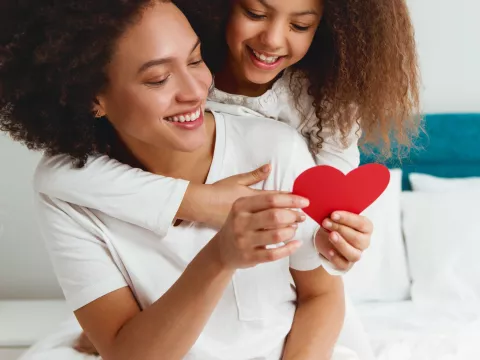 Woman and daughter with heart