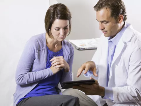 Woman reviewing chart with her doctor