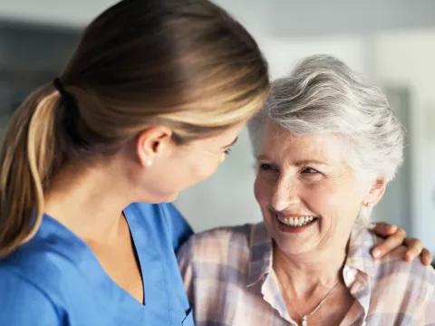 A woman talks to her doctor about her mammogram results