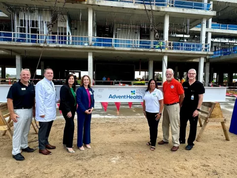 Leaders at AdventHealth Minneola topping-out ceremony