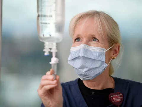 An AdventHealth nurse modifying an IV pouch