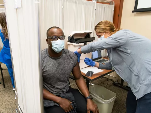 Man receives Pfizer COVID19 Vaccinations at AdventHealth Daytona Beach