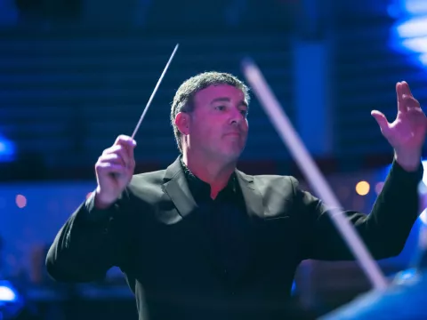 Richard Hickam conducts the AdventHealth employee orchestra.