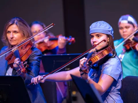 The AdventHealth employee orchestra performs a requiem performance.