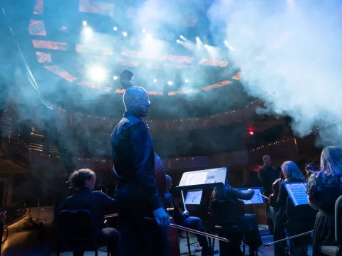 Rob Roy plays bass with the AdventHealth employee orchestra during a requiem performance.