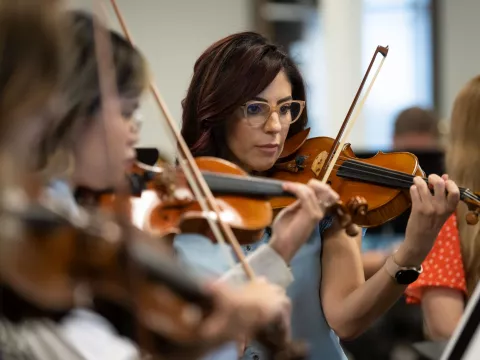 The AdventHealth employee orchestra rehearses.