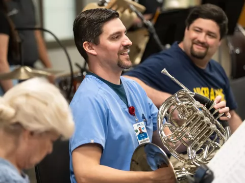 The AdventHealth employee orchestra rehearses.