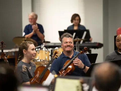 The AdventHealth employee orchestra rehearses.
