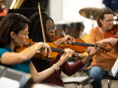 The AdventHealth employee orchestra rehearses.