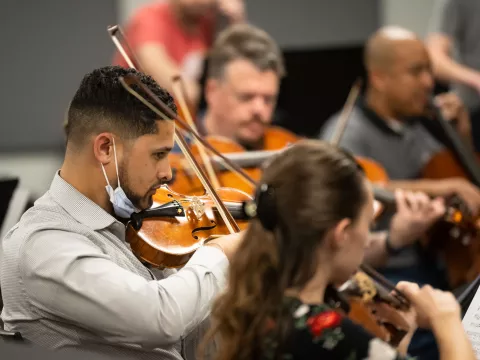 The AdventHealth employee orchestra rehearses.