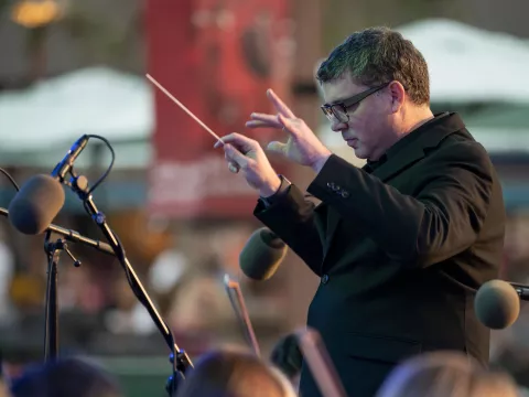 Richard Hickam directs the AdventHealth employee orchestra.