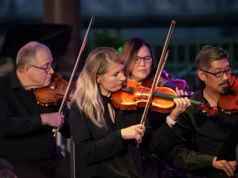 The AdventHealth employee orchestra performs at Disney Springs. 