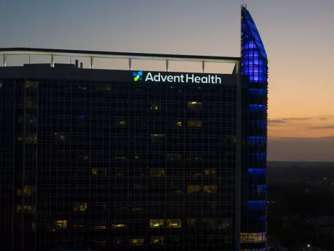 AdventHealth Orlando Ginsberg tower at dusk