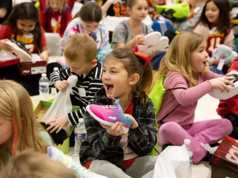 A student at Wellsville Elementary School receives a brand new, name brand pair of athletic shoes.