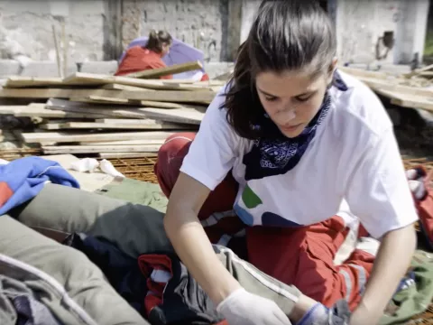 Adventist missionary helping someone.