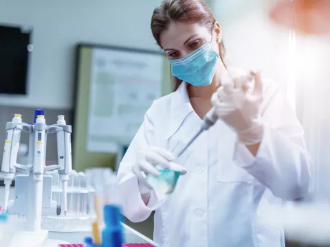  Masked Physician in lab working 