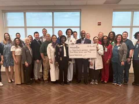 AdventHealth Waterman team members gather for the check presentation.