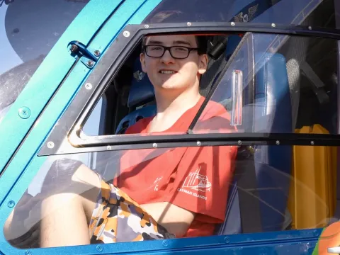 Teenager Anthony Moir sits in cockpit of AdventHealth's Flight 1 medical helicopter