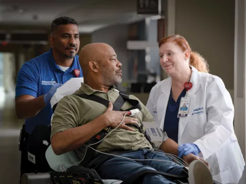 Patient with doctor going into in Emergency Room.
