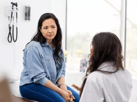 A woman talks to her doctor.