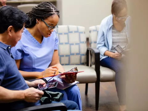 Man talking to nurse in ER