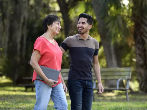 A man and woman walking outdoors in Florida