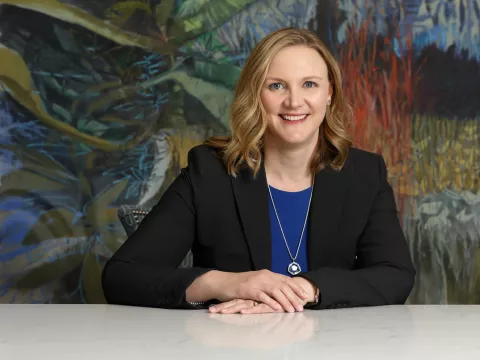 Dr. Lisa Hays sitting with arms crossed