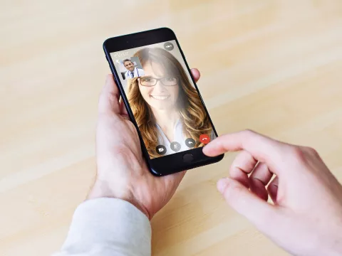 Doctor caring for his patient through our video visit app.