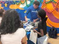 A man shows a child an experiment