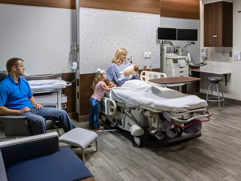 A family and newborn baby in The Baby Place suites at AdventHealth Gordon