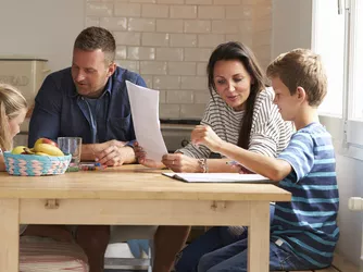 Family making New Year's Resolutions together