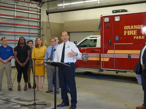A man giving a speech at the Fire department