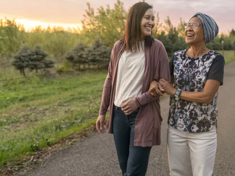 Mother and Daughter Walking Outdoors