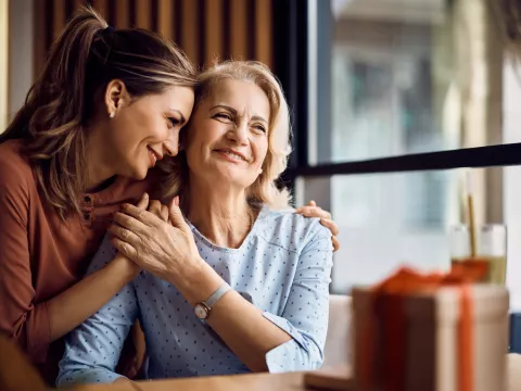 women embrace with support